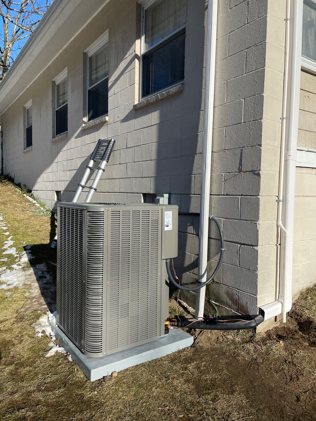 Lennox outdoor condenser installed on a pad at a Darien home by Celco