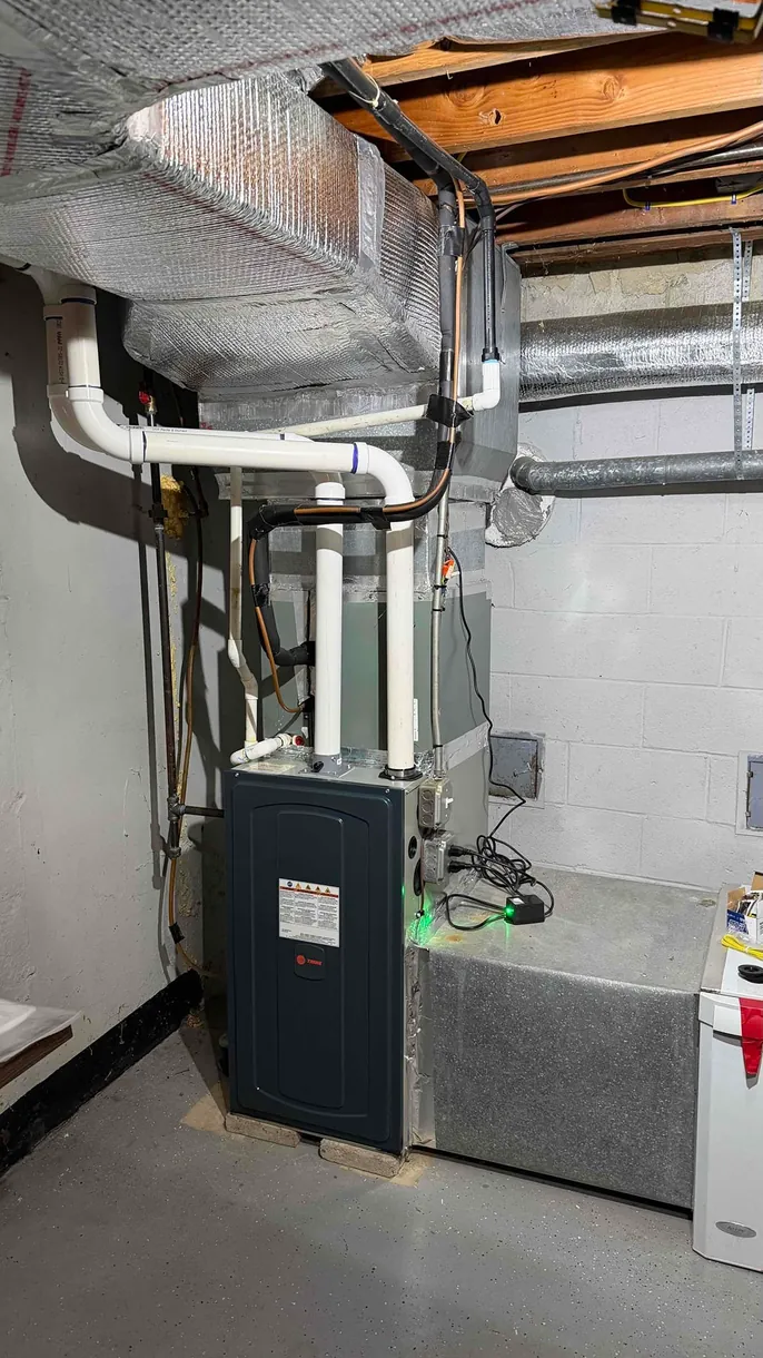Trane direct-vent furnace with PVC venting installed in a Stamford, CT basement by Celco