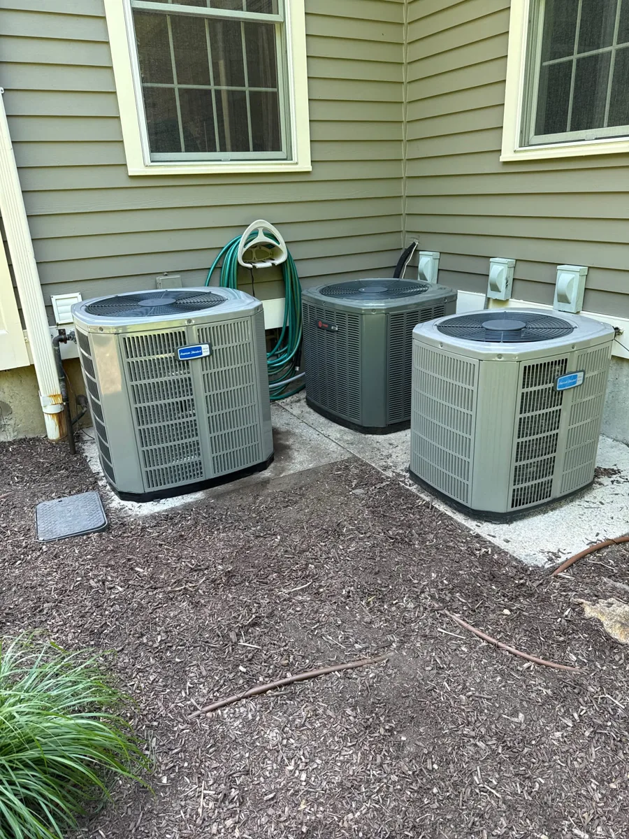 American Standard outdoor condensing units on a pad beside an Easton, CT home, part of a Celco air handler and condenser replacement