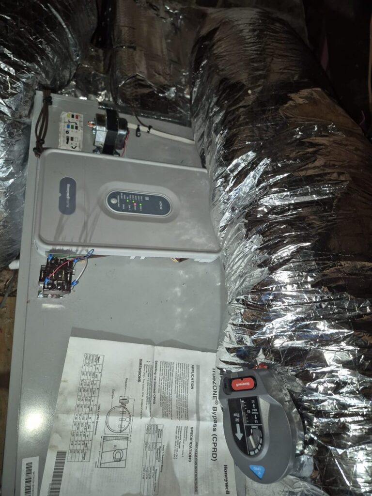 Insulated flexible ductwork connected to equipment in a Fairfield, CT attic, from a Celco installation