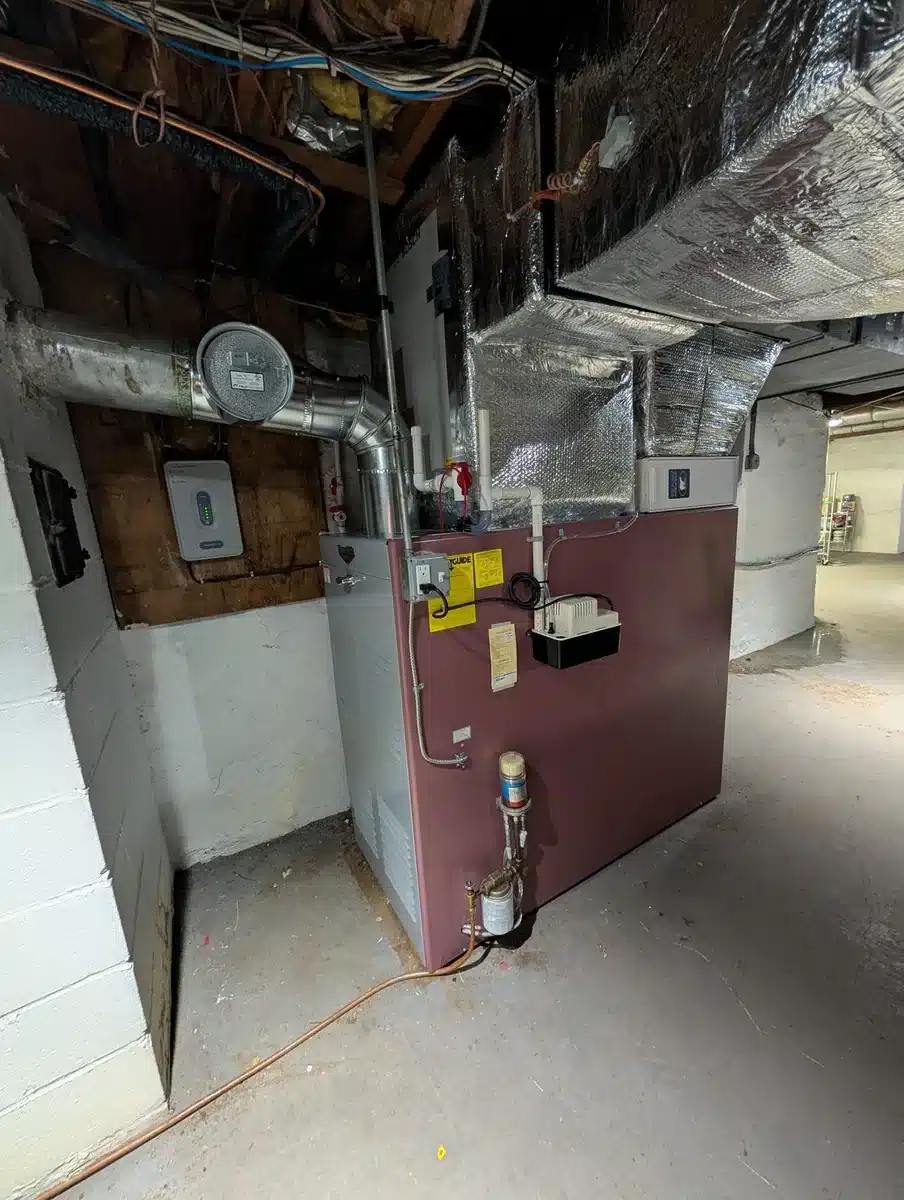 New Thermo Pride oil furnace with new insulated ductwork installed in a Greenwich, CT basement by Celco