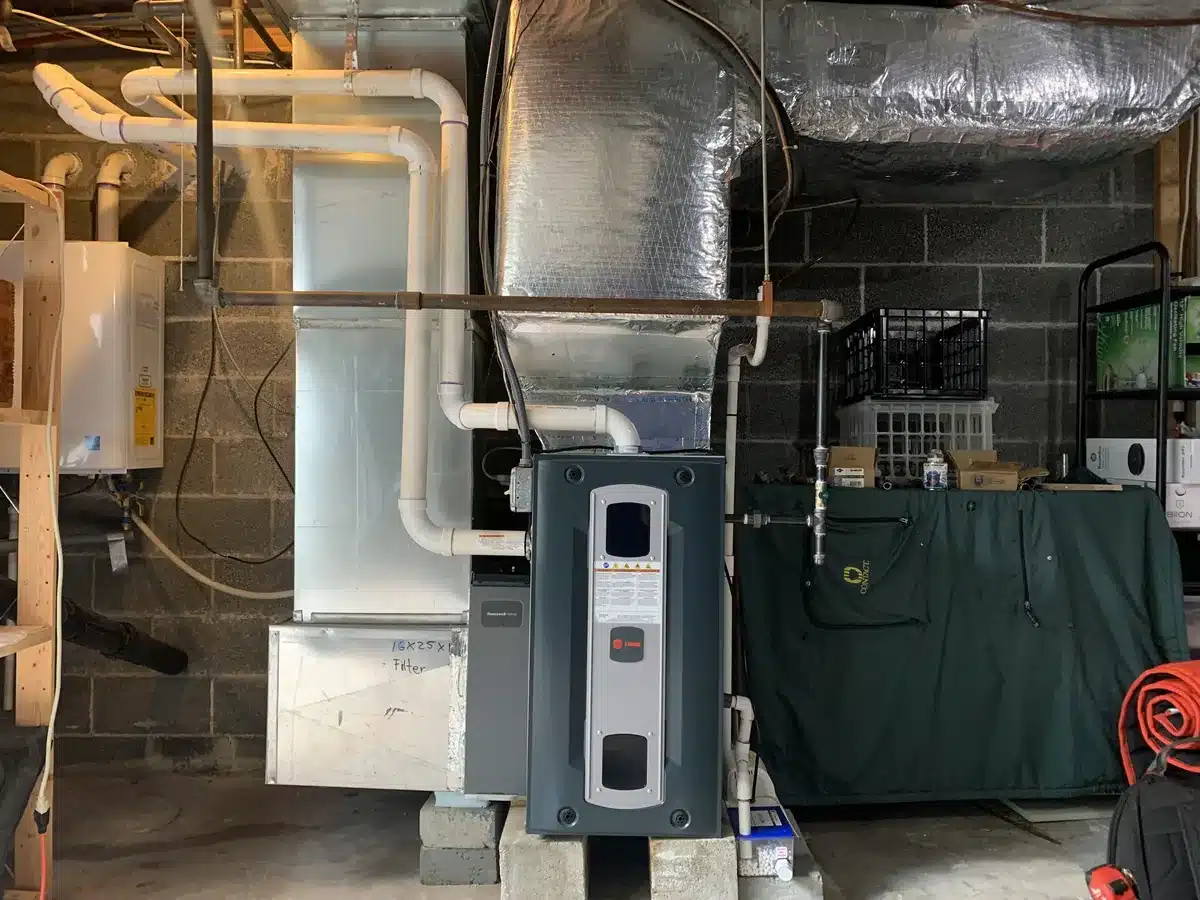 New Trane gas furnace with new insulated ductwork installed in a Greenwich, CT basement by Celco