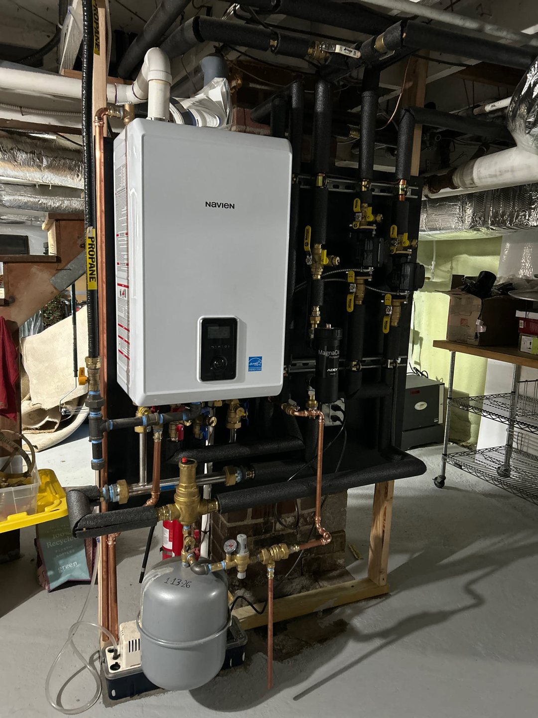 Navien propane combination boiler / tankless water heater installed in a Wilton home by Celco